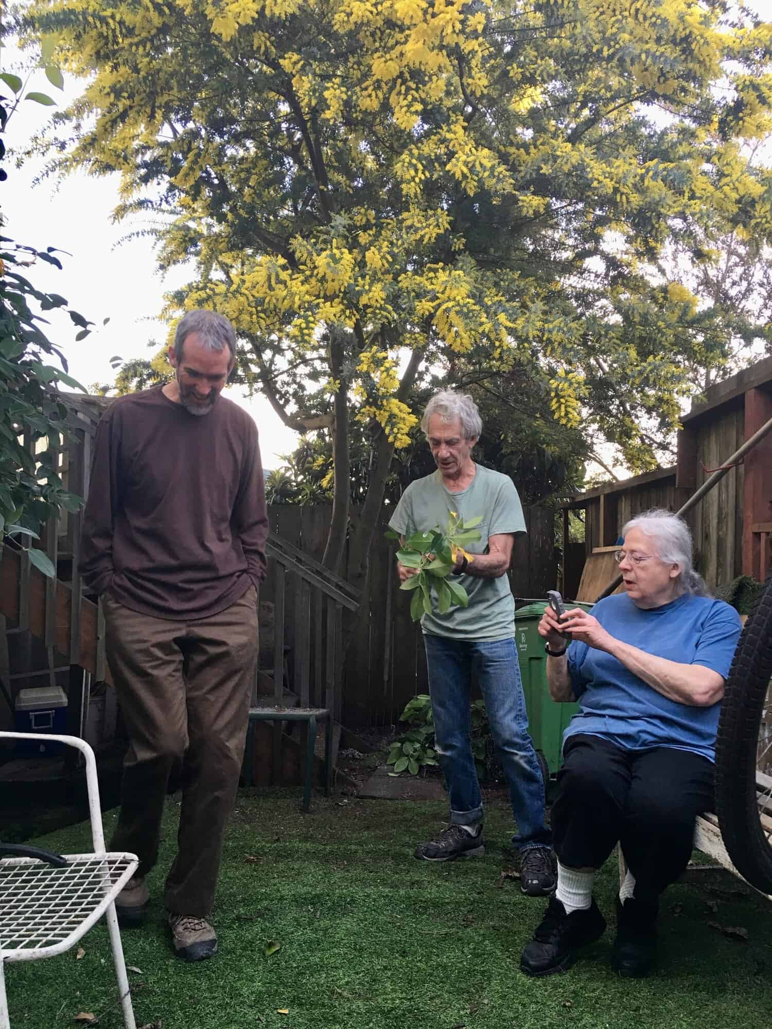 Steve, Michael, and Susan in a tree-shaded back yard