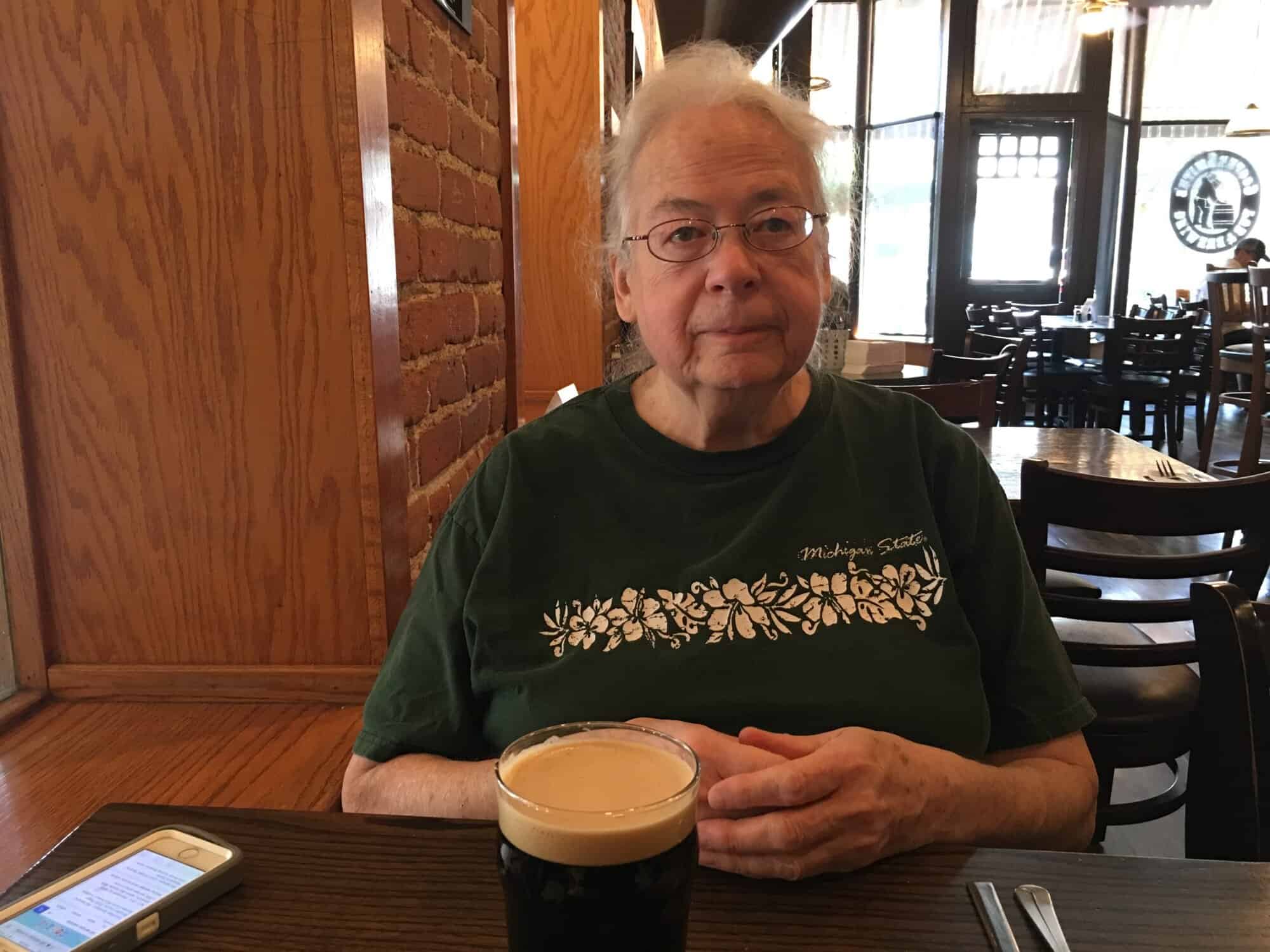 Susan at Coopersmith's with a dark beer