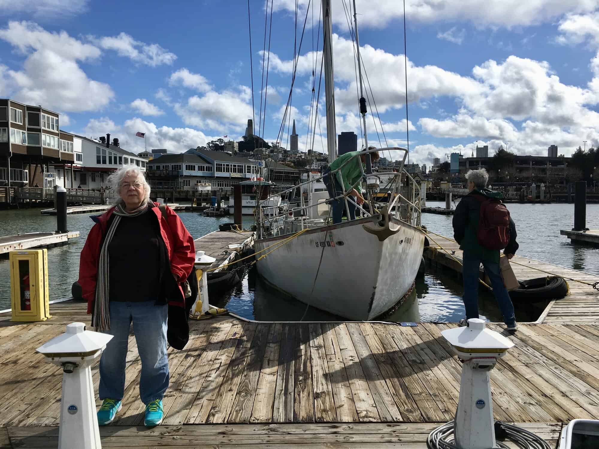 Susan and Michael on Pier 39 on the dock near the sailboat