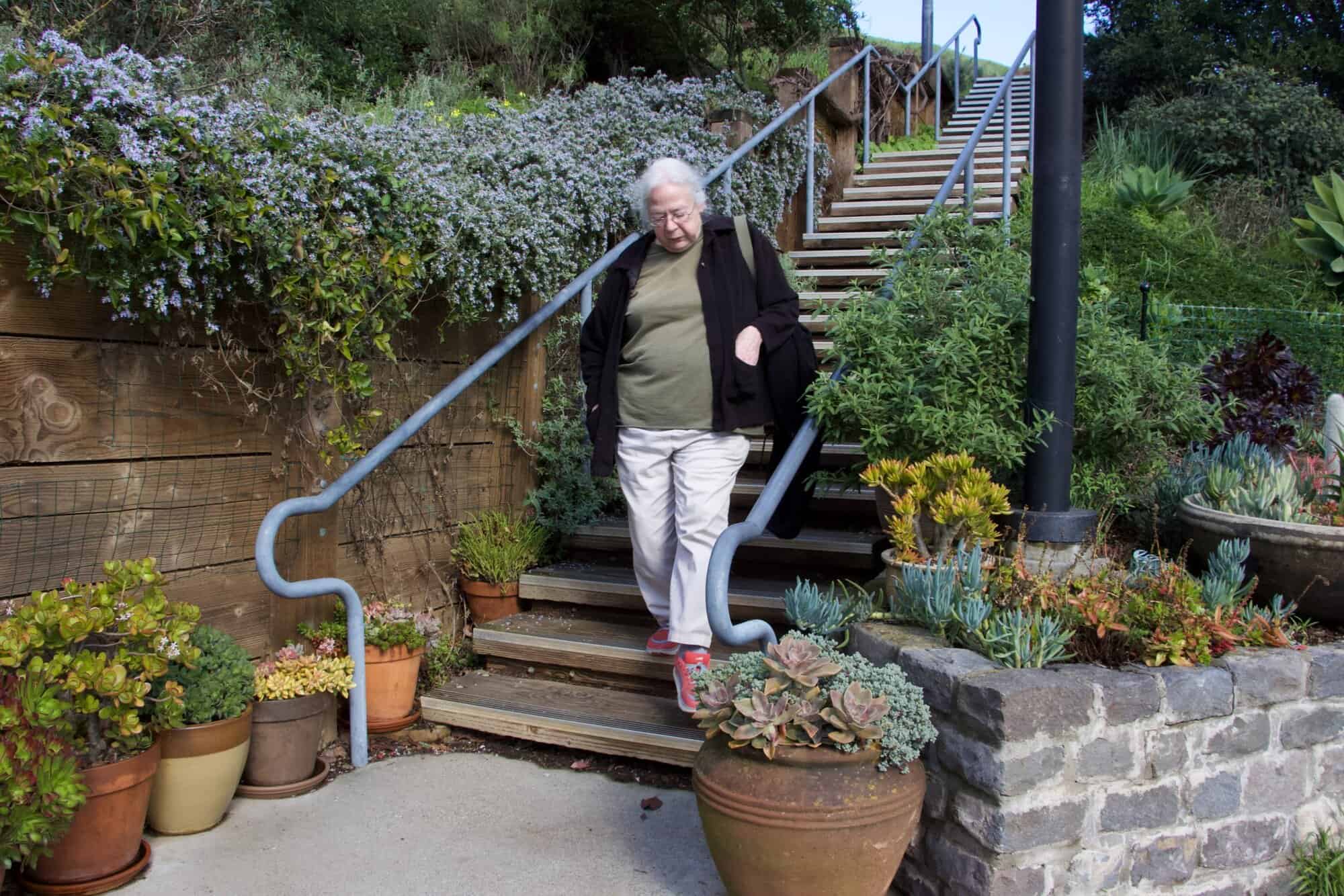 Susan walking down stairs in a San Francisco public garden